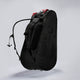 Black Cancha tennis backpack with red accents on a white background